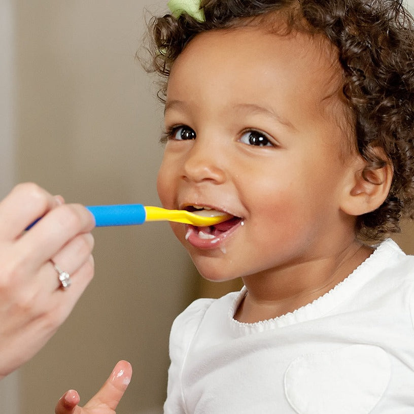 Child being fed with ARK Z-Spoon
