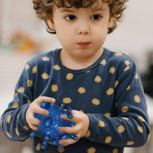 Boy holding Puffer Stress Ball 4 Pack