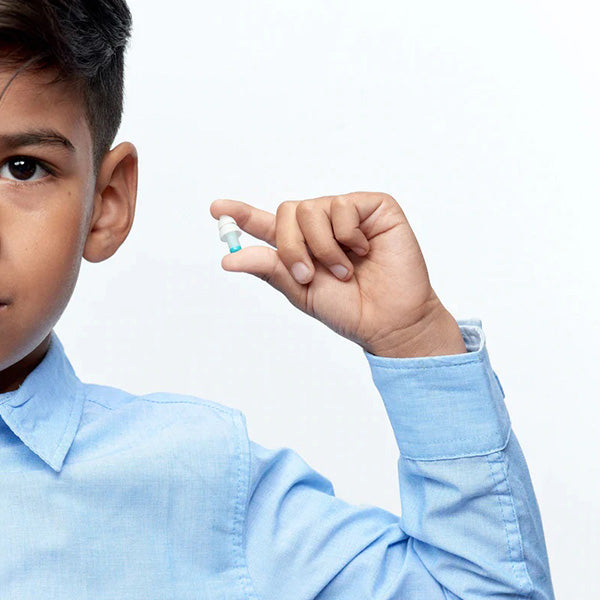 Boy holding Alpine Pluggies Kids