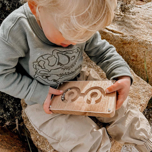 Boy holding Wooden Balance Fidget Game Twin targets