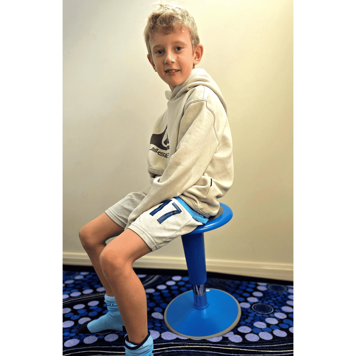 Boy sitting on Sensory Specialist wriggle stool