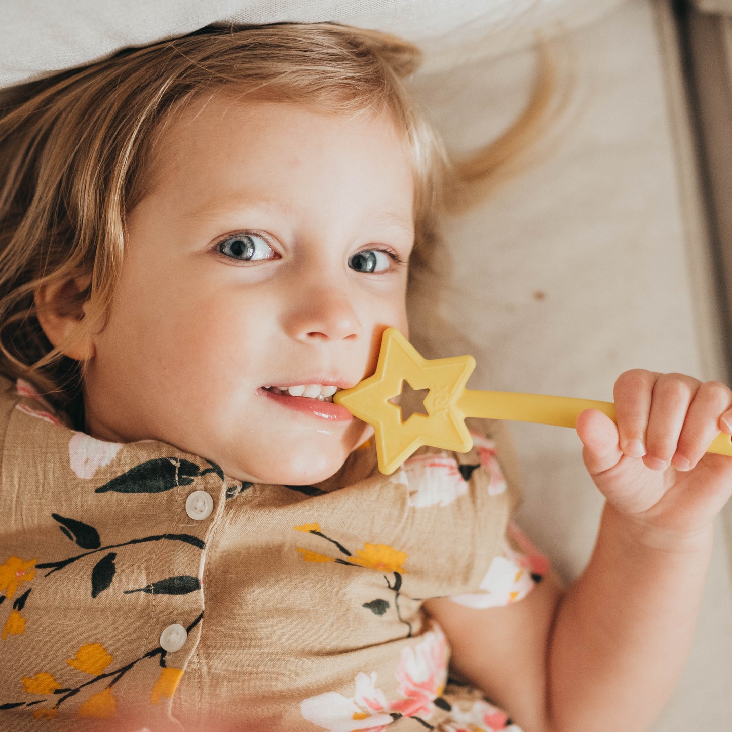 Girl chewing ARK Sensory Chew Star wand