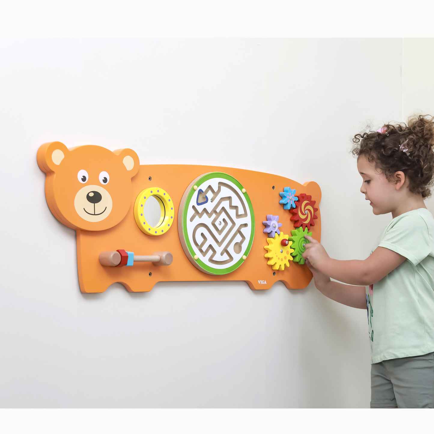 Child playing with Interactive wall activity bear