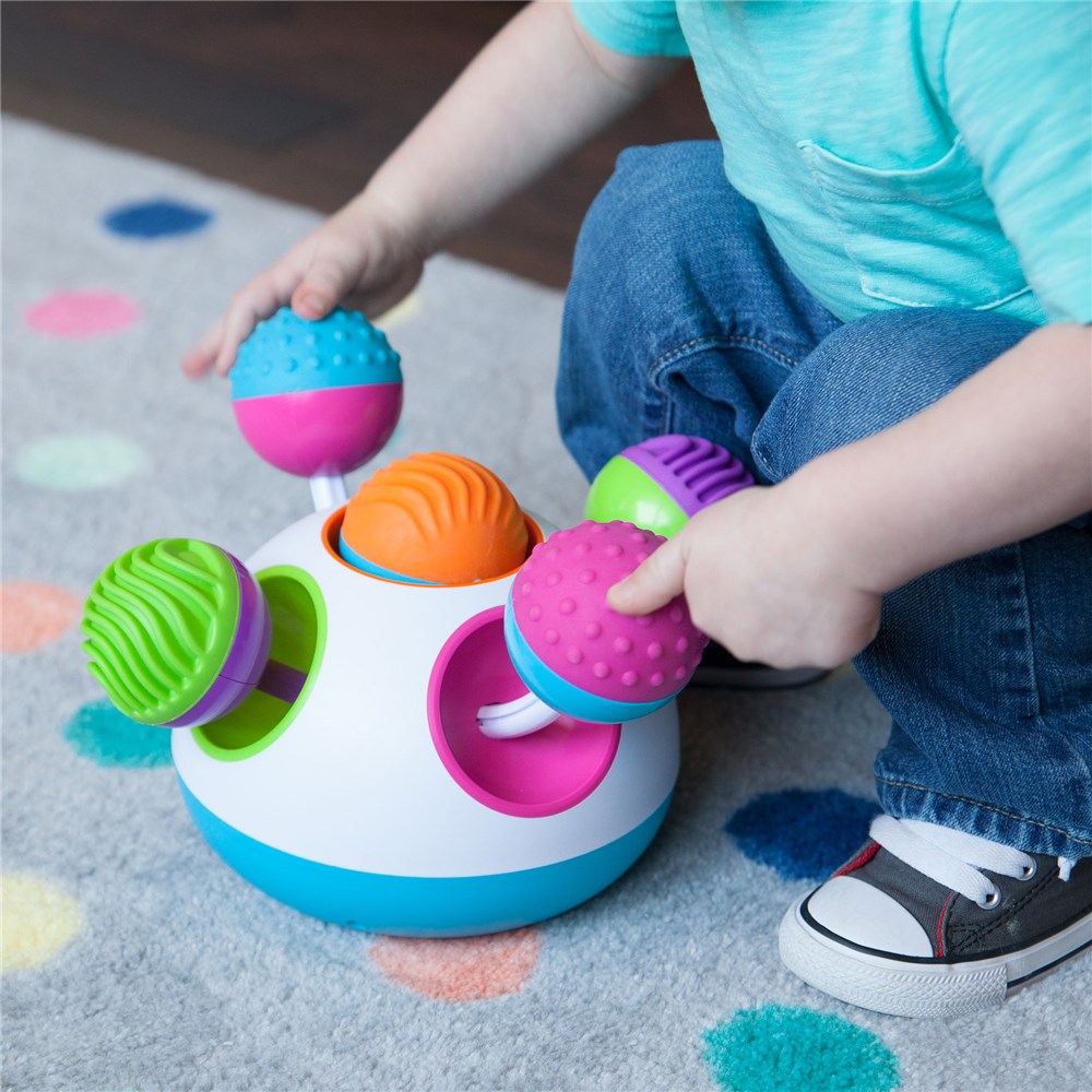 Child playing with Klickity by Fat Brain Toys