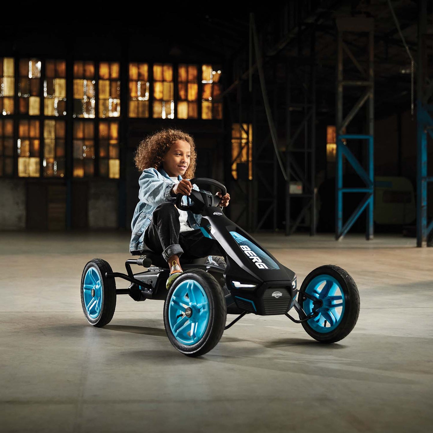 Child riding Berg Rally APX Blue Go-Kart