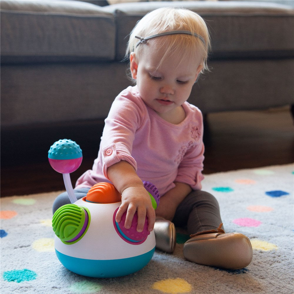Child playing with Klickity by Fat Brain Toys