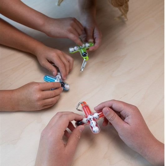 Kids playing with Tiltago Keychain