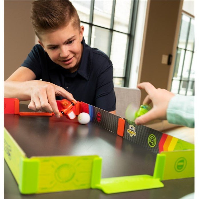 Boy playing Foosbots Stadium Battle Set