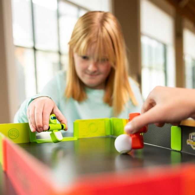 Girl playing Foosbots Stadium Battle Set
