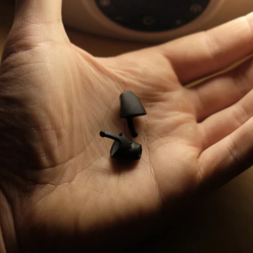 Flare Calmer Night Ear plugs black in hand
