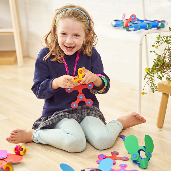 Girl playing with Clixo Rainbow Pack