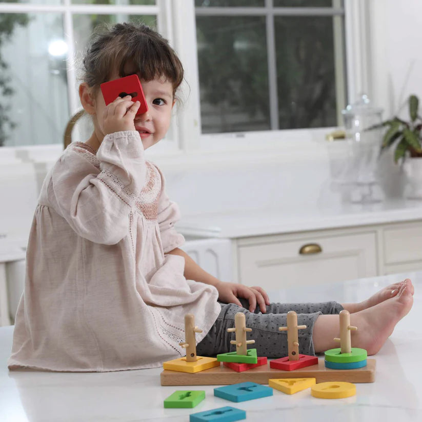 GIrl holding Crazy Stick Puzzle Piece