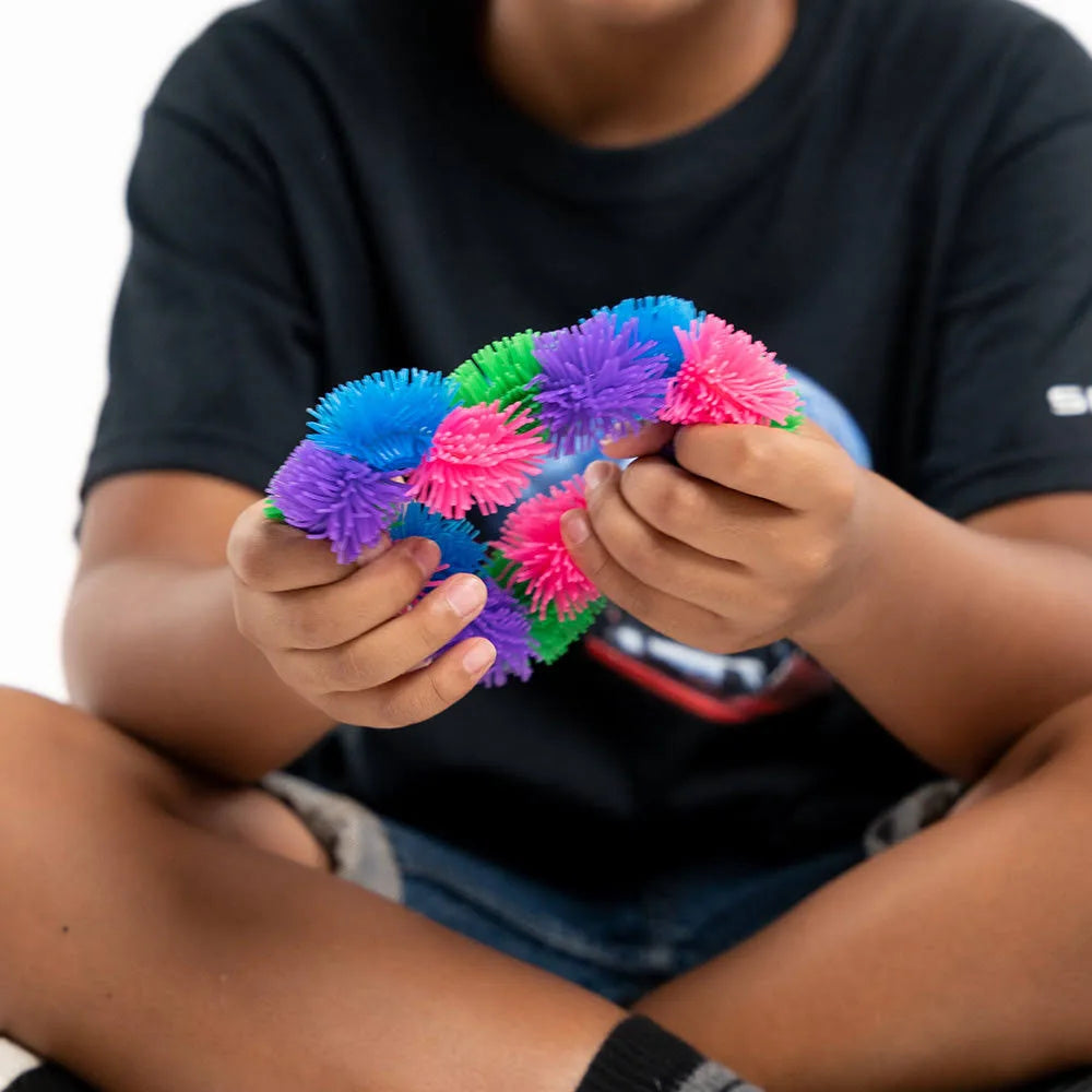Boy playing with Hairy Tangle