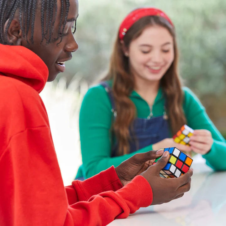 Kids playing with Rubiks Starter Pack
