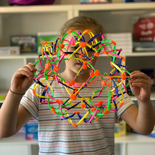 Boy using Expandaball Hoberman Sphere
