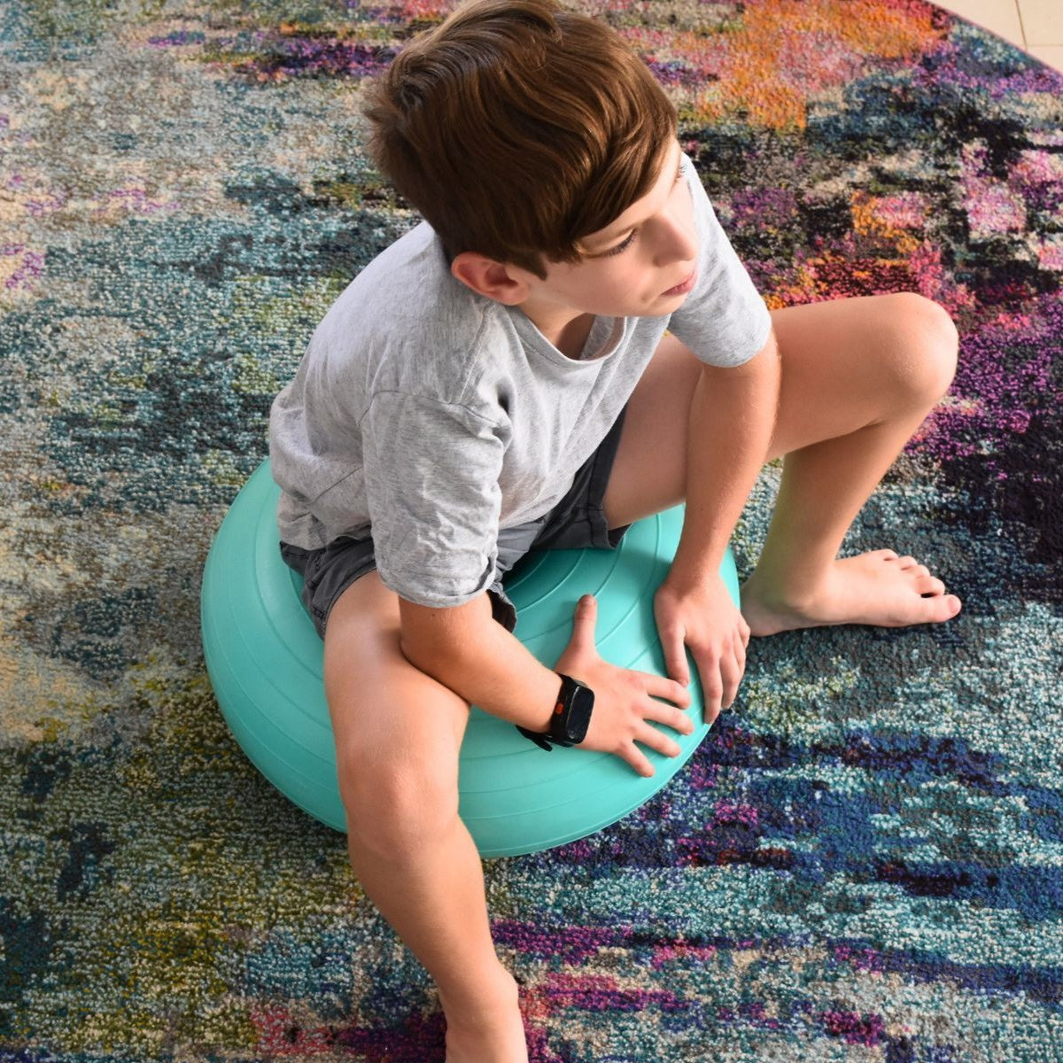 Boy on Donut therapy ball