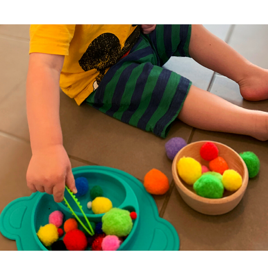 child using Pom Pom & Tweezers
