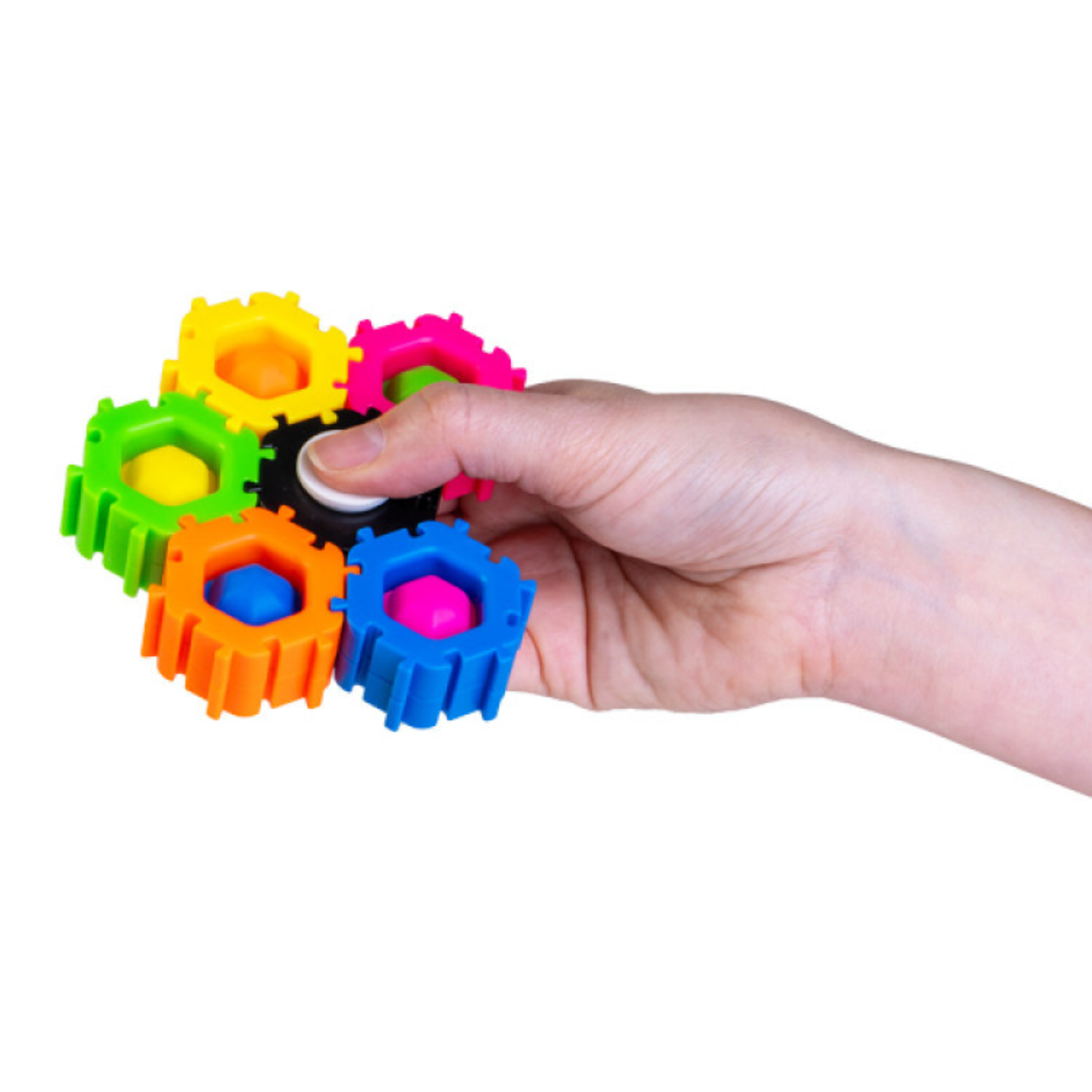 Colorful gear puzzle toy being held by a hand on a white background
