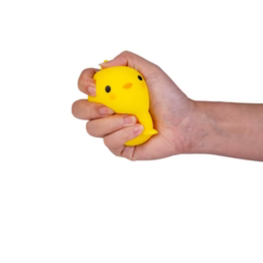 Yellow Chick squishy being squeezed by hand