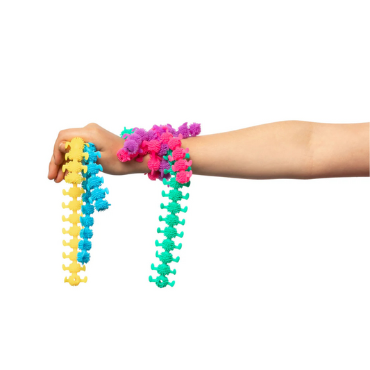5 coloured stretchy caterpillars hanging on childs wrist.