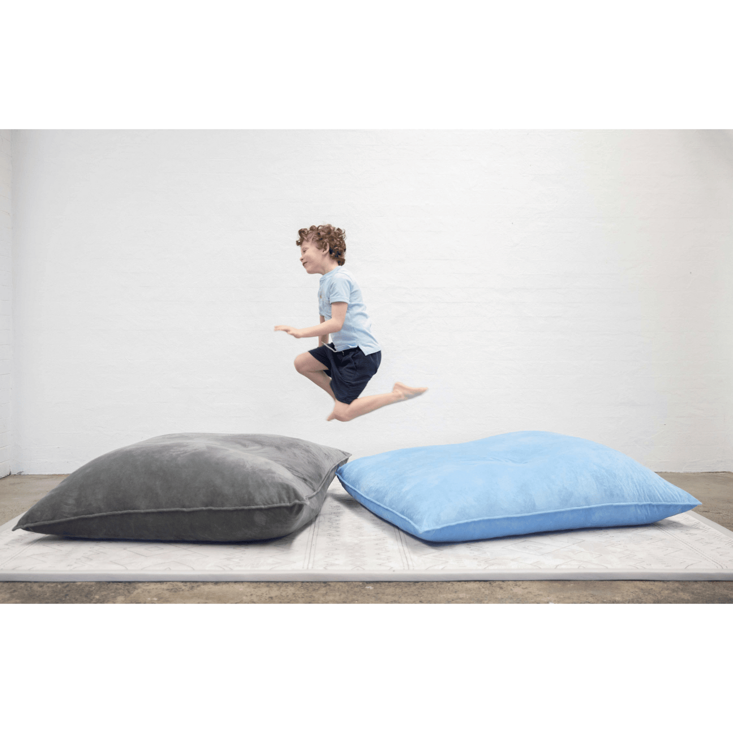 Mooshy Mat Crash Mat Boy jumping onto mat