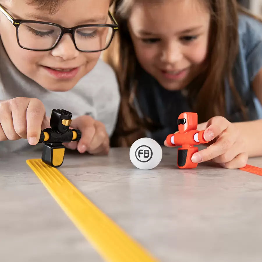 Kids playing with Foosbots 2 Pack