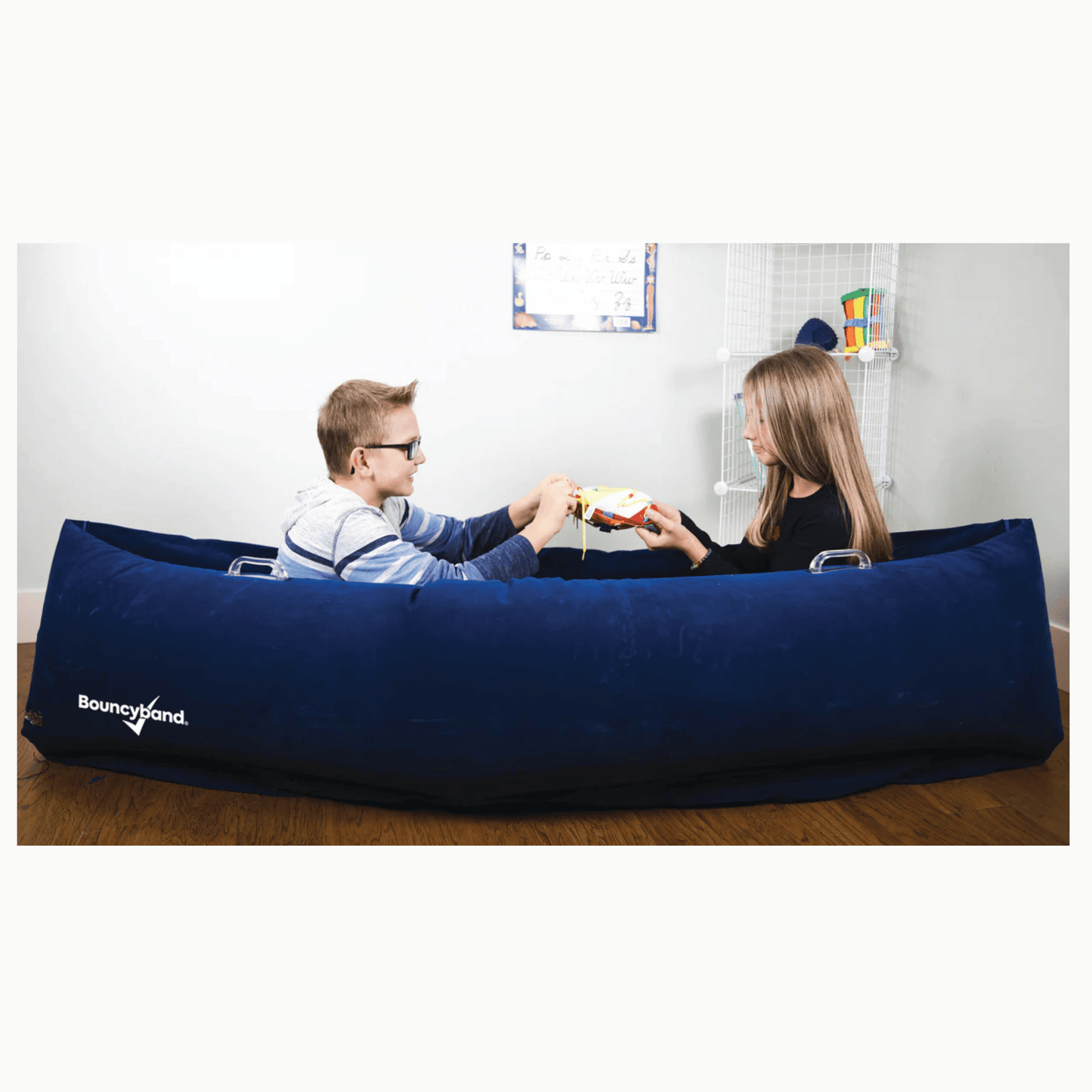 two kids sitting in Playlearn calming peapod