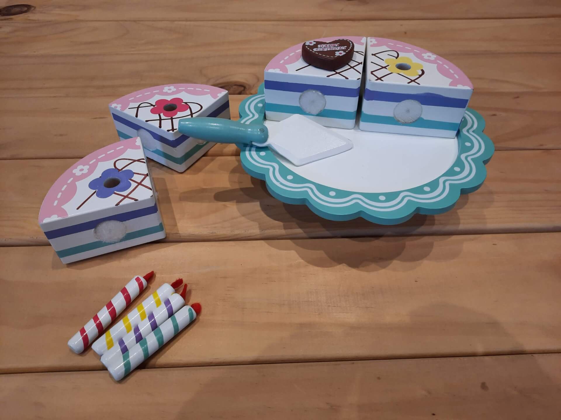 Wooden birthday cake on stand pieces