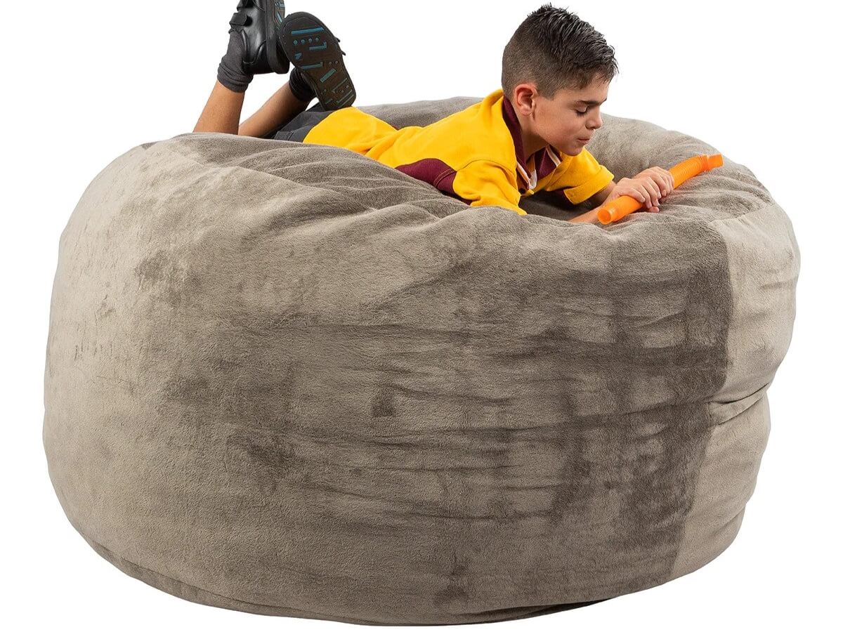 Boy lying on Calming Cloud chair