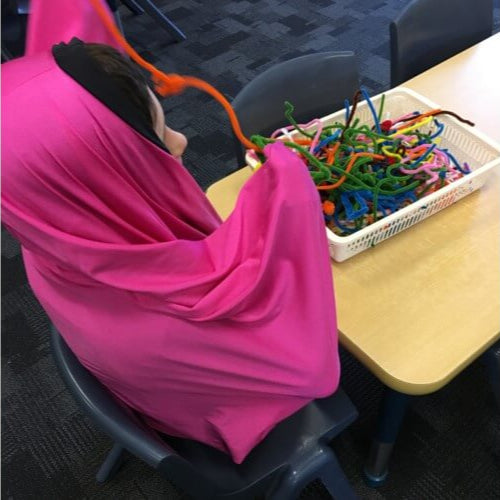 Child in Body Sock at school