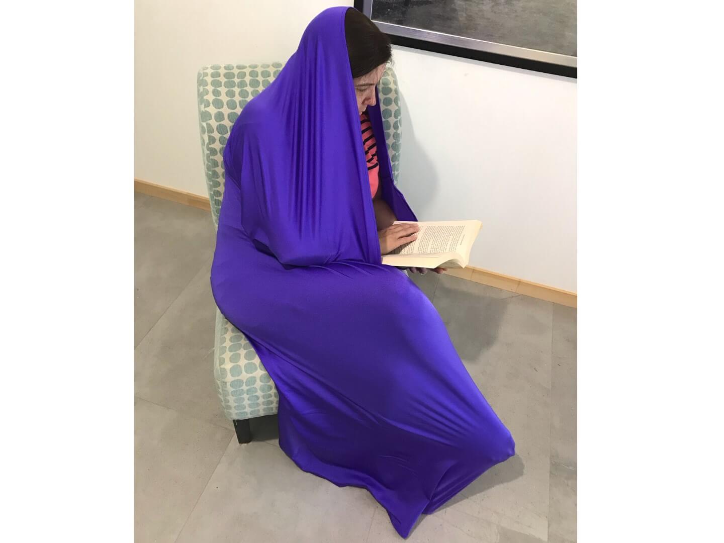Woman reading in movement tube