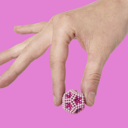 Speks Pixel Magnetic Ball Fidget pink in hand