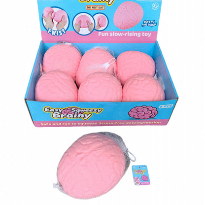 A retail display box filled with pink brain-shaped squishy toys, with one loose toy and a small tag shown in front on a white background. The packaging reads 'Easy Squeeezy Brainy'.