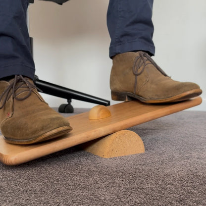 Adult using Balance board with half cork