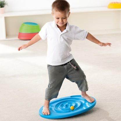 Boy balancing on Weplay maze balance board