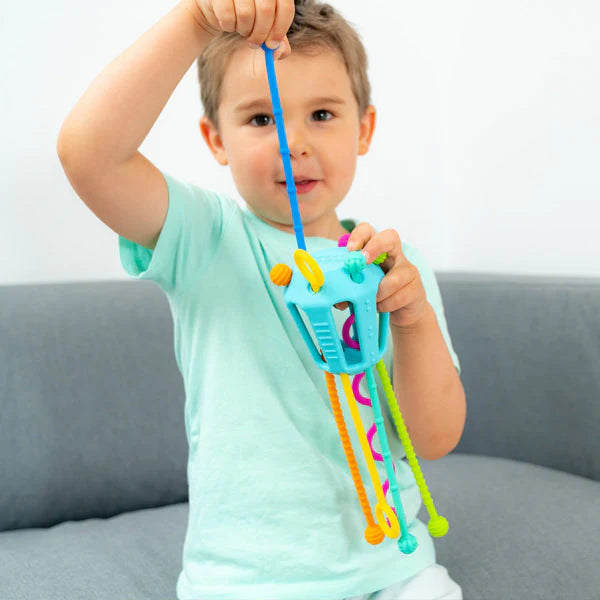 Boy playing with Mobi Zippee Toy