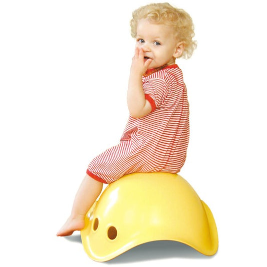 Child Sitting on Bilibo Classic Yellow