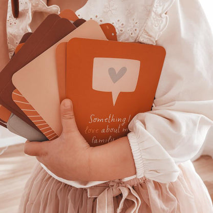 Girl holding Creative Sprouts Gratitude Cards pack of 26