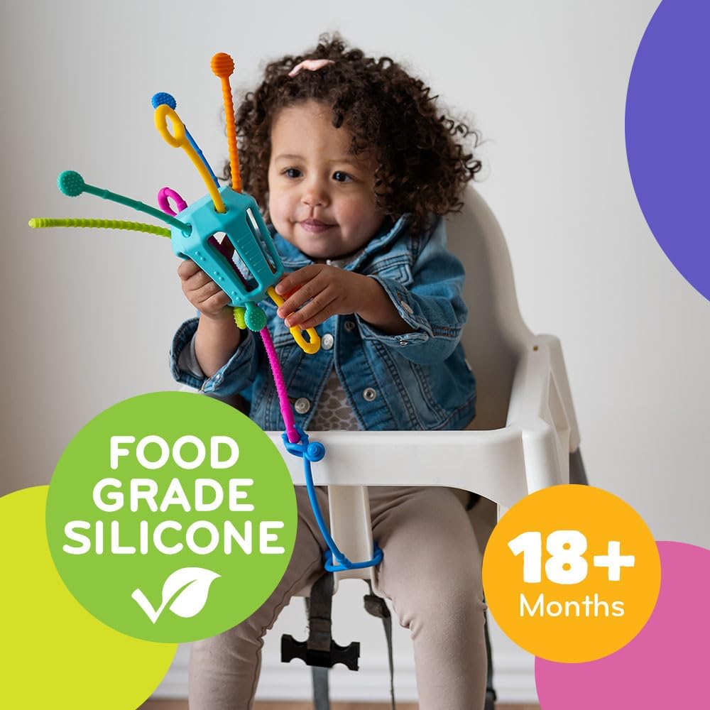 Child in high chair playing with Mobi Zippee Toy