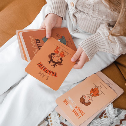 Girl looking at Creative Sprout Affirmation Cards