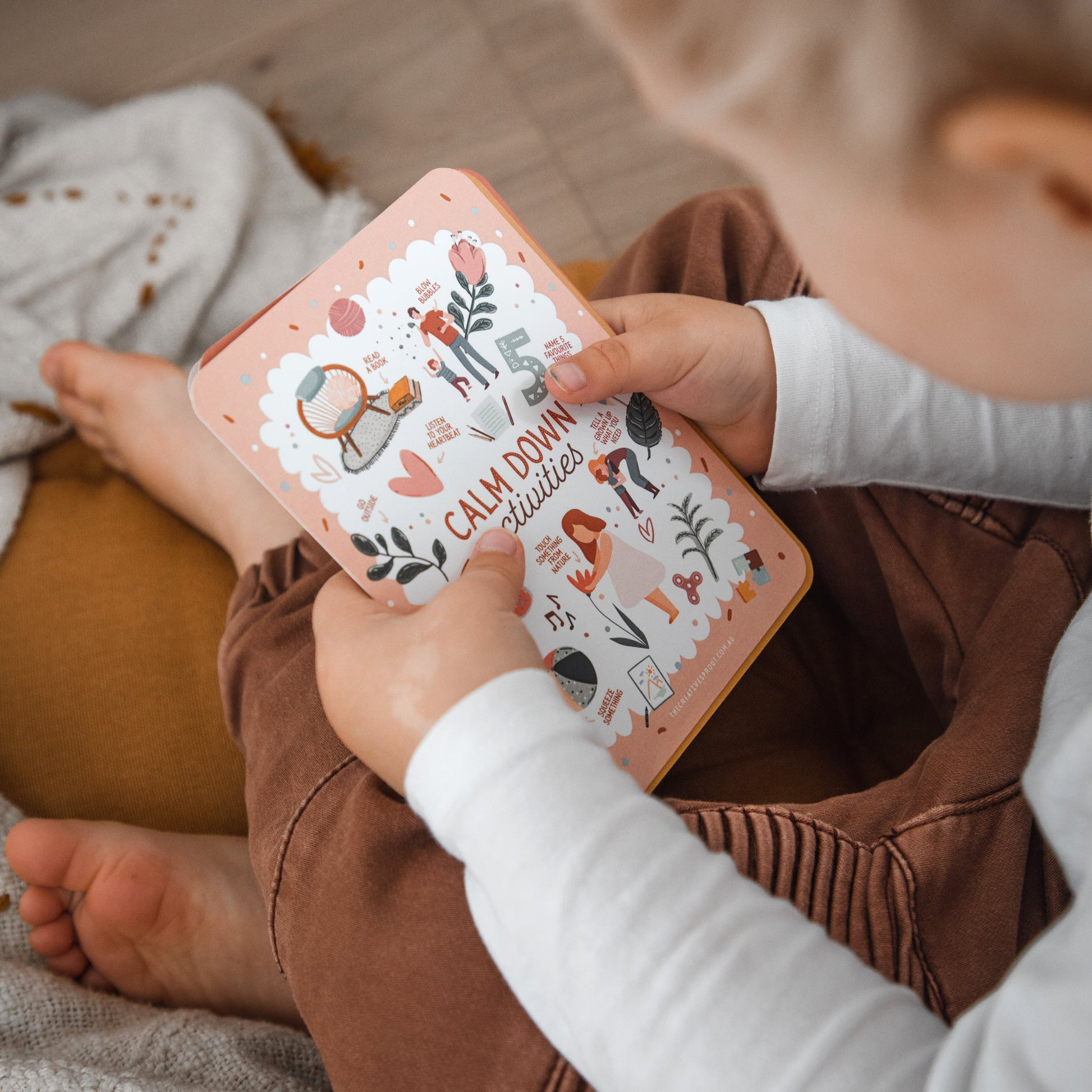 Child reading Calm Down Cards 