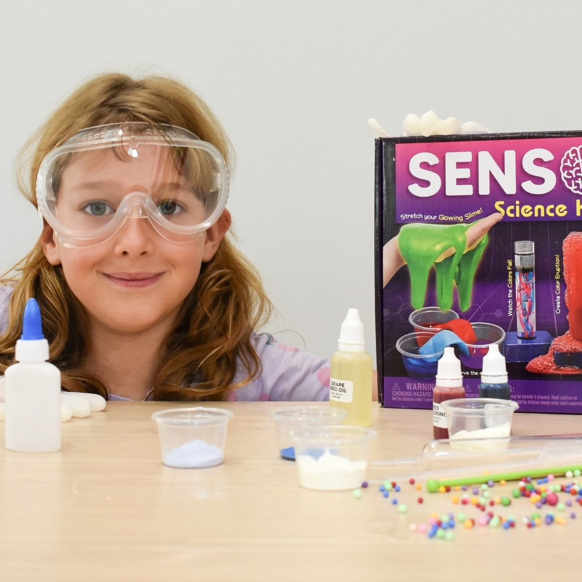 Girl with glasses and Sensory Science Kit