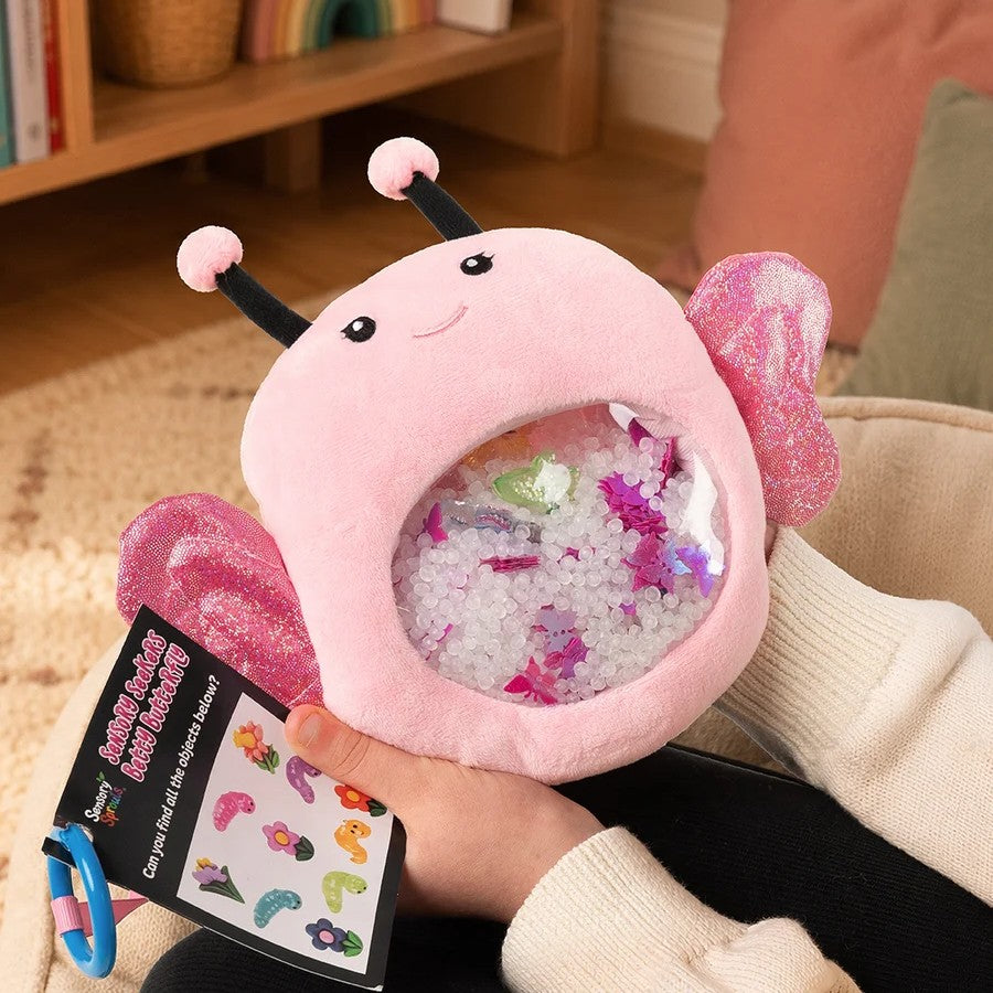 Girl playing with Sensory Seekers Interactive seek and find toy