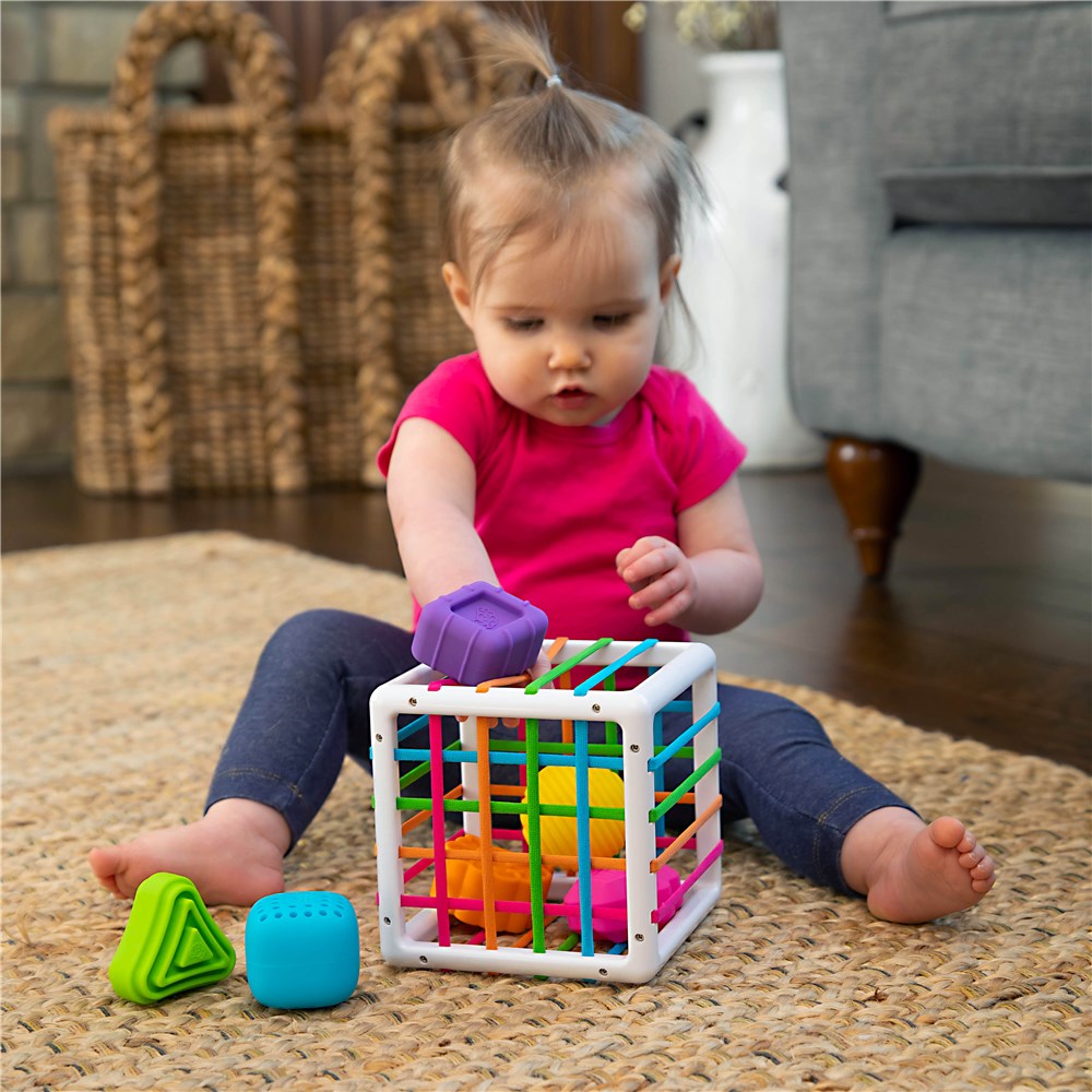 Toddler playing with Inny Bin