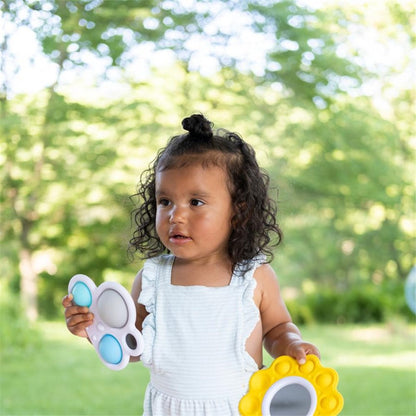 Child holding Fat Brain Toys Dimpl Billows and bright