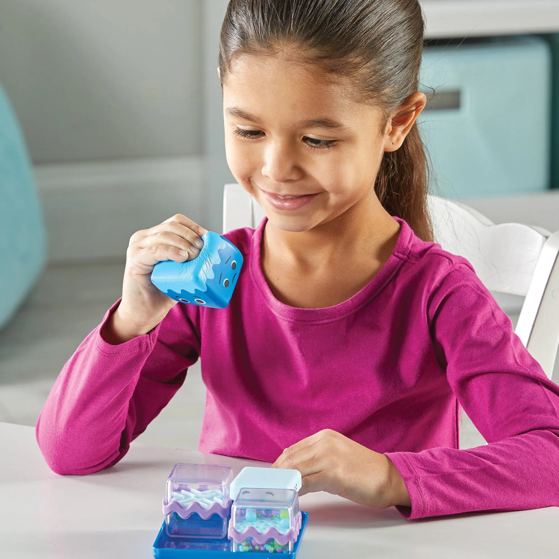 Girl playing with Cool Down Cubes set of 4