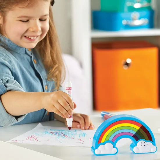 Girl drawing using rainbow visual timer