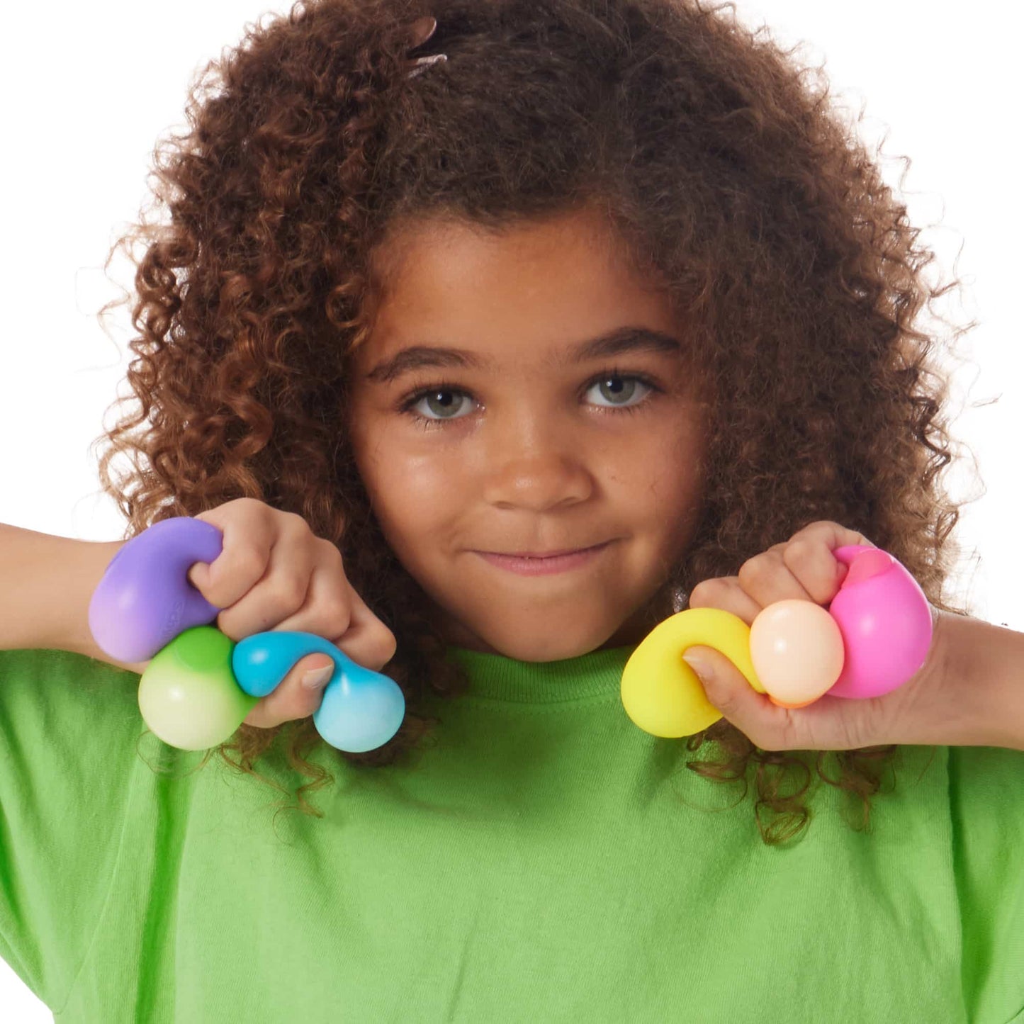 Girl Squishing Nee Doh Teenie Rainbow