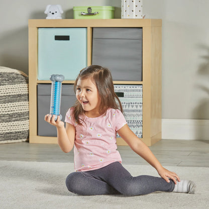 Girl looking at Sounds of Rain Sensory Tubes
