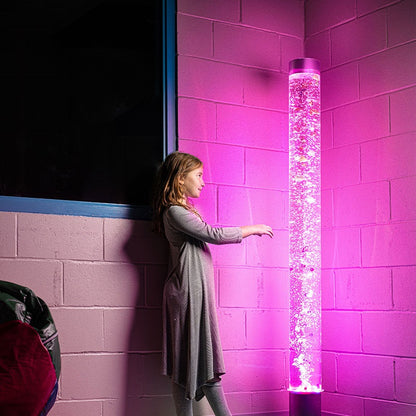Girl looking at Bubble Tube sensory column